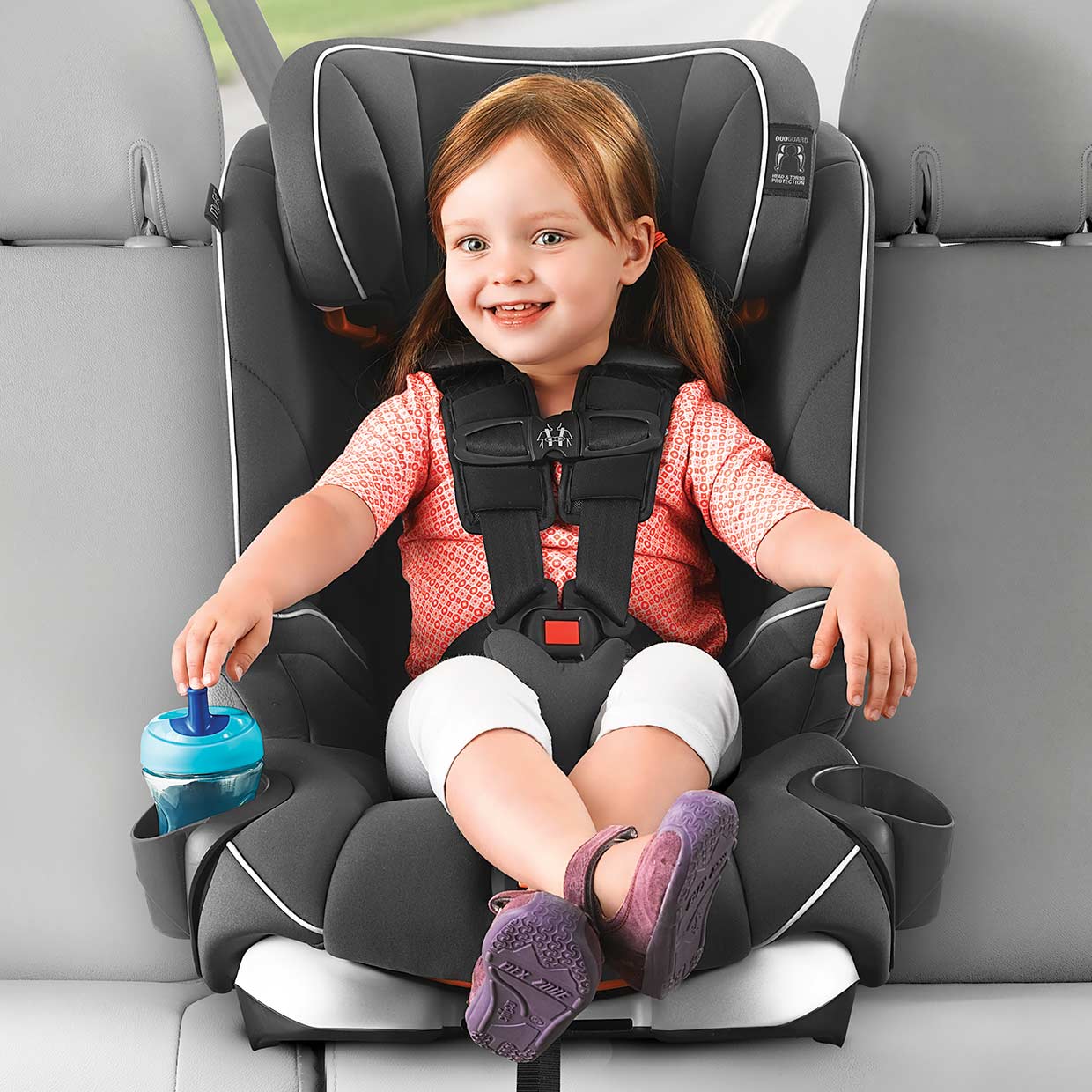 child sitting in a forward-facing car seat